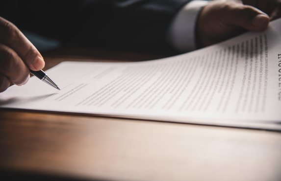 Signing the paperwork at the end of a matter